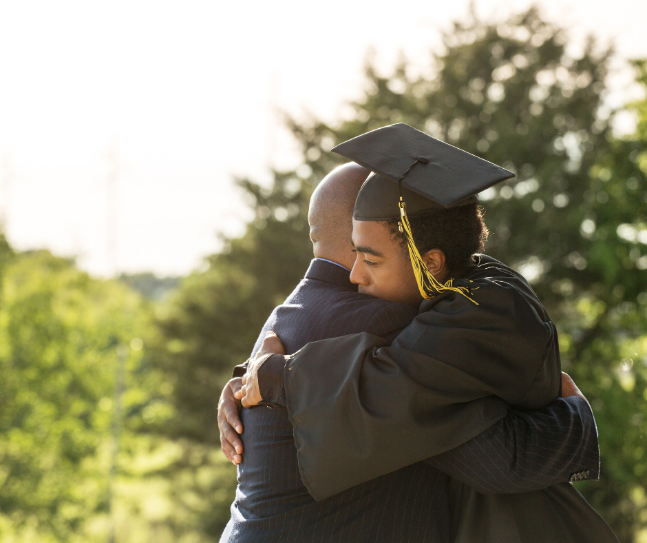 Graduating student hugs their teacher